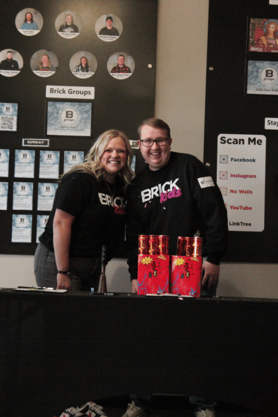 two people standing at a table