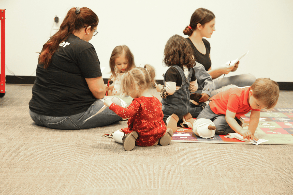 leaders playing in floor with kids