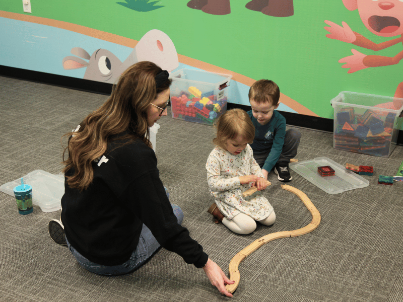 Brick Kids leader playing with children